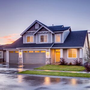 Elegant suburban home with driveway at sunset showcasing modern architecture.